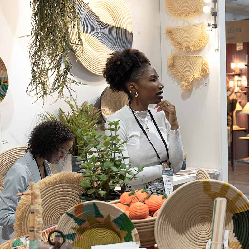 Exhibitor talking to buyer at Las Vegas Market.